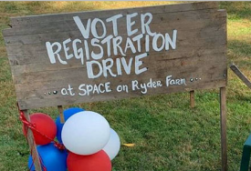 Voter registration sign at SPACE on Ryder Farm