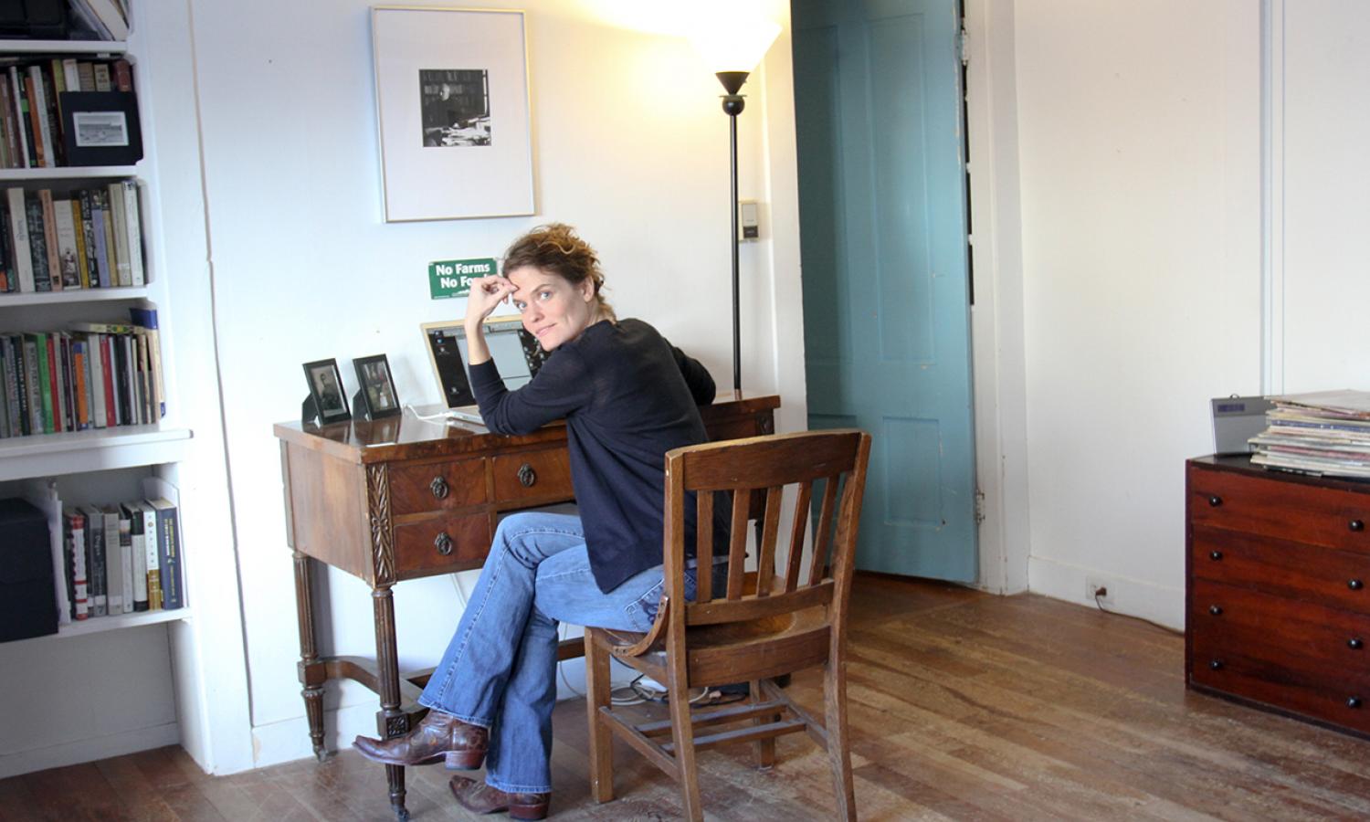 Writing Fellow, Rebecca Gayle Howell, seated at her desk.