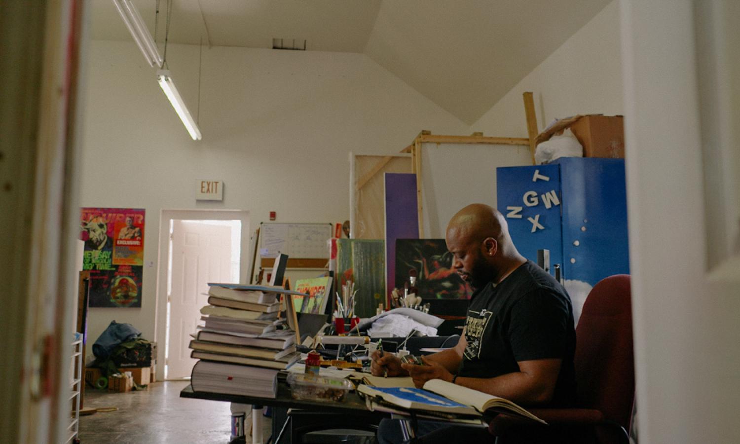 Muralist Fabian Williams sits in his studio, a film with Kristian Melom, produced by the South Fulton Institute as part of the Filmer Partners Program.