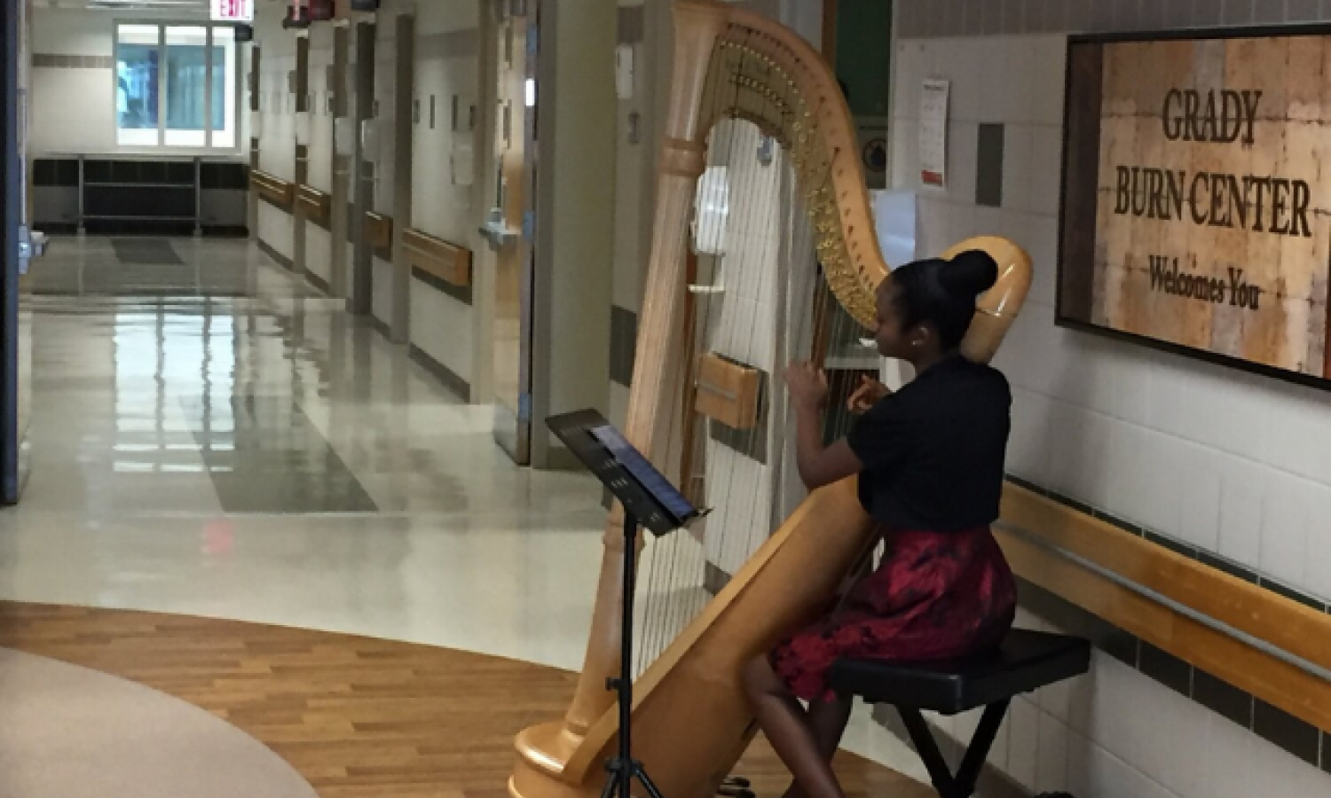 Harpist and SFI alum Angelica Hairston performs in Grady Burn Unit.