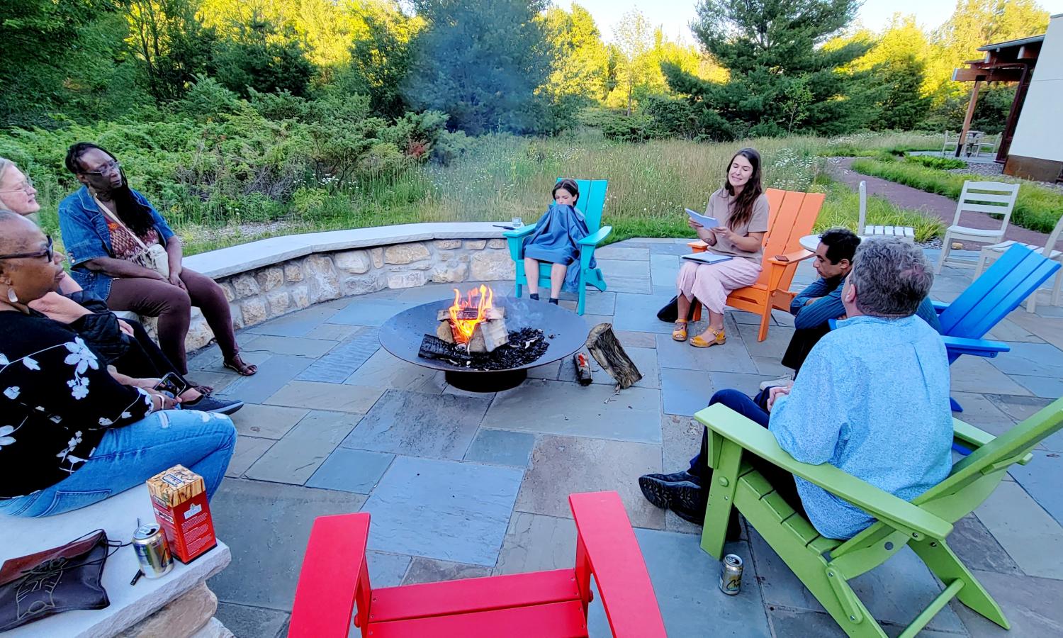 Residents gathering at the writing center fire pit.