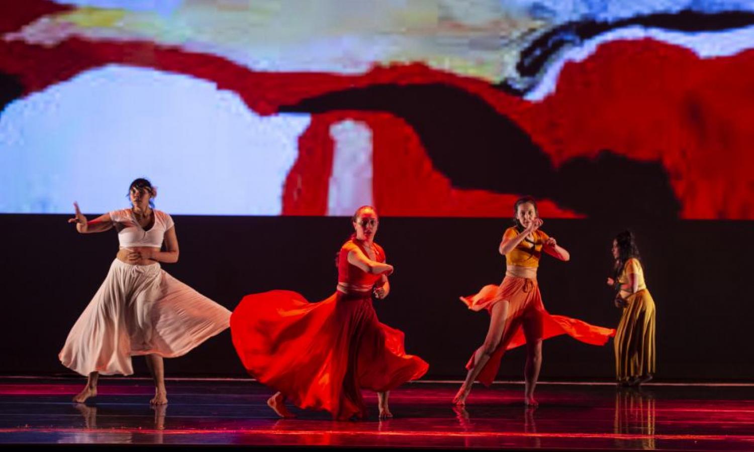 Indigenous dancers performing on stage