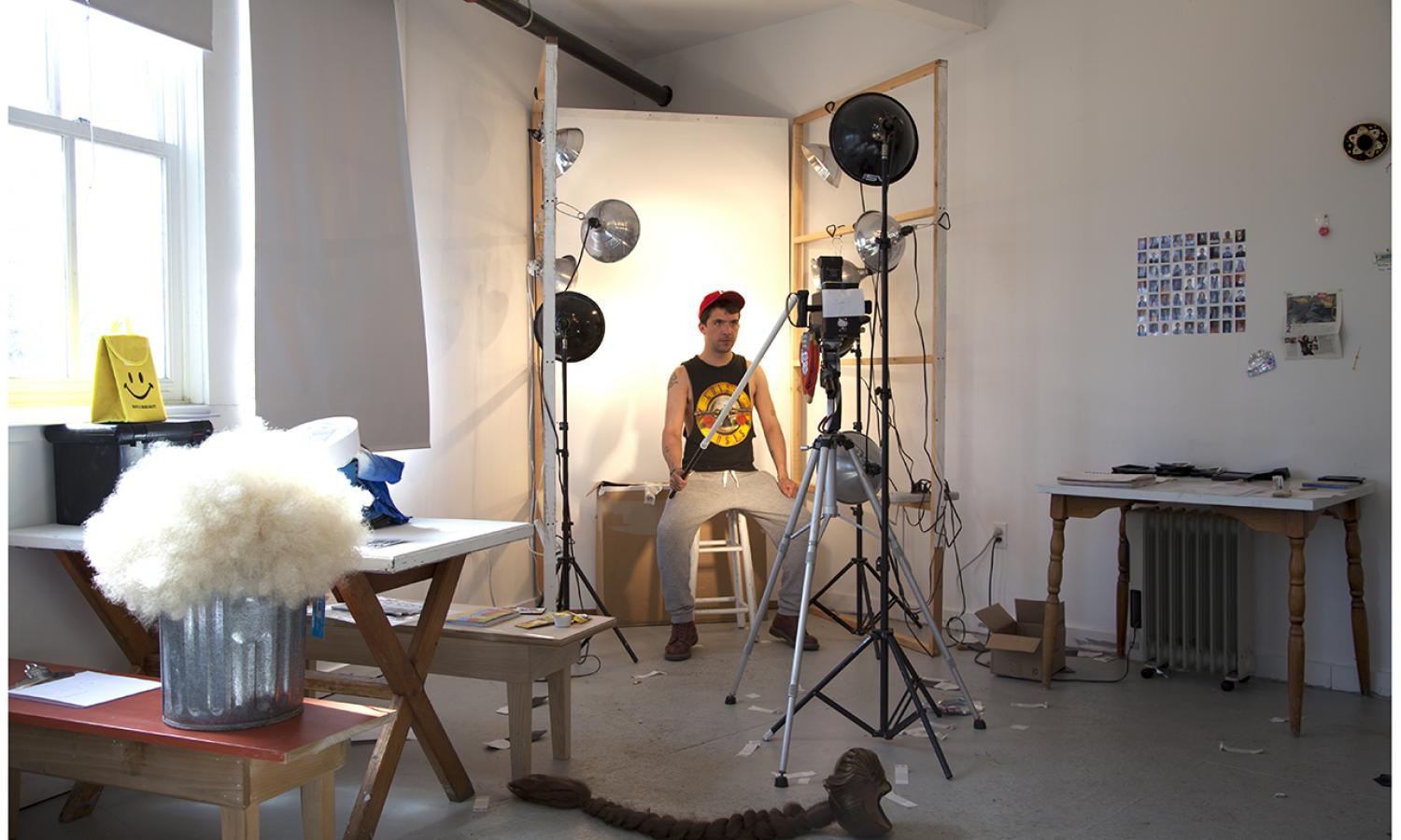 Visual Arts Fellow, Juan Pablo Echeverri, taking a self-portrait in his studio