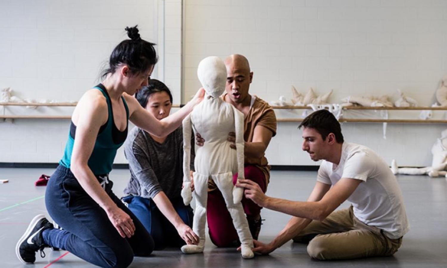 four Puppeteers working in the studio