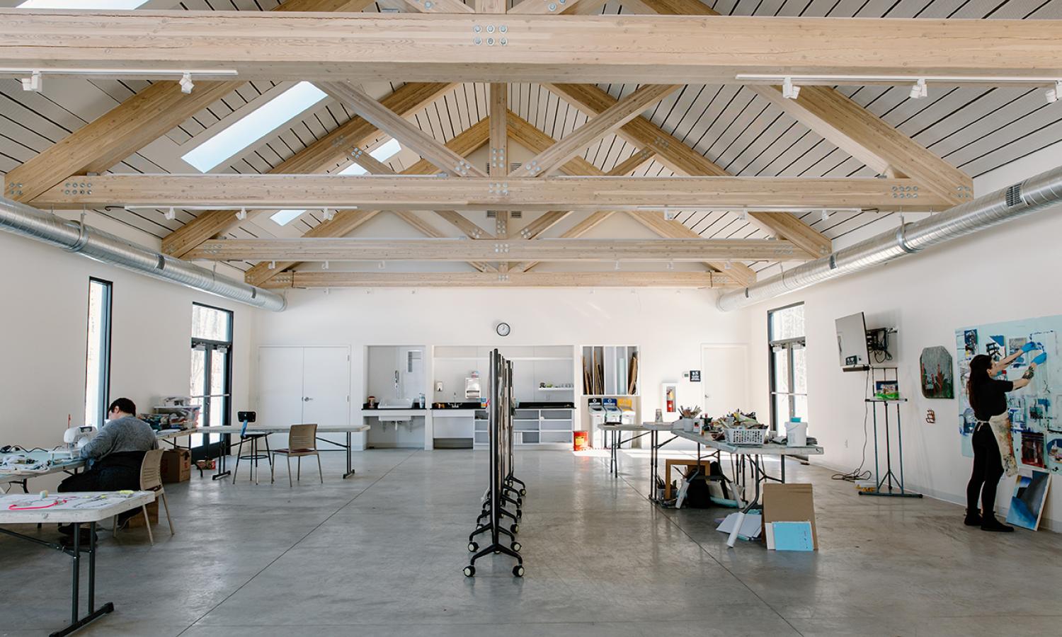 Interior of Artists-in-Residence Studio Building showing semi-private workspaces. Photo Credit: xoMe Studio