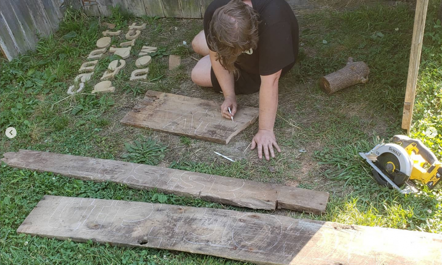 Alex Hanson works on his installation on the property