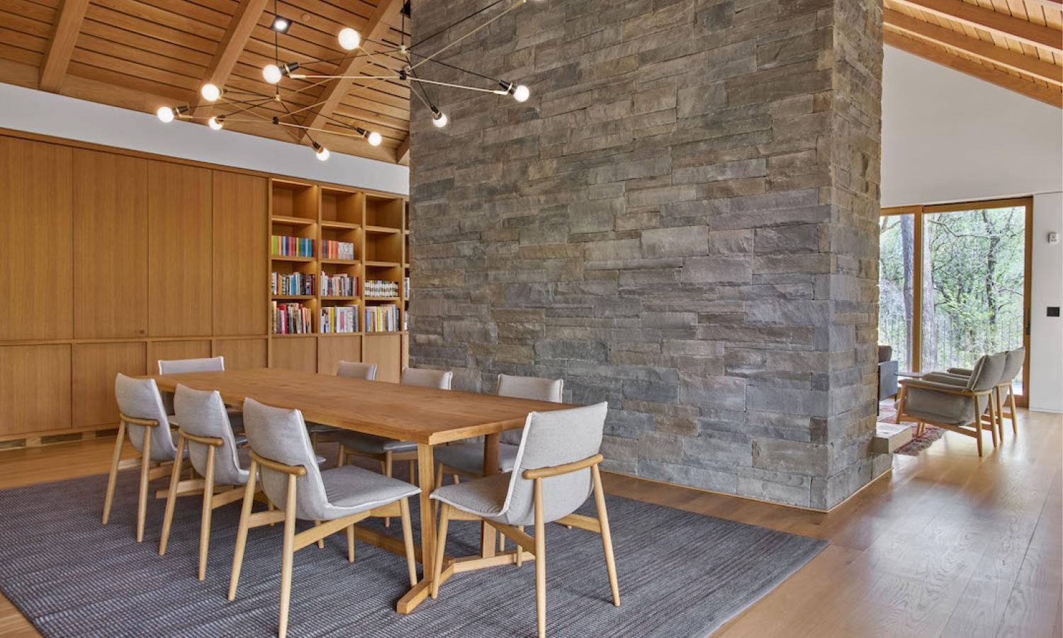 Interior of the McDonough House showing a dining room table, library, fireplace