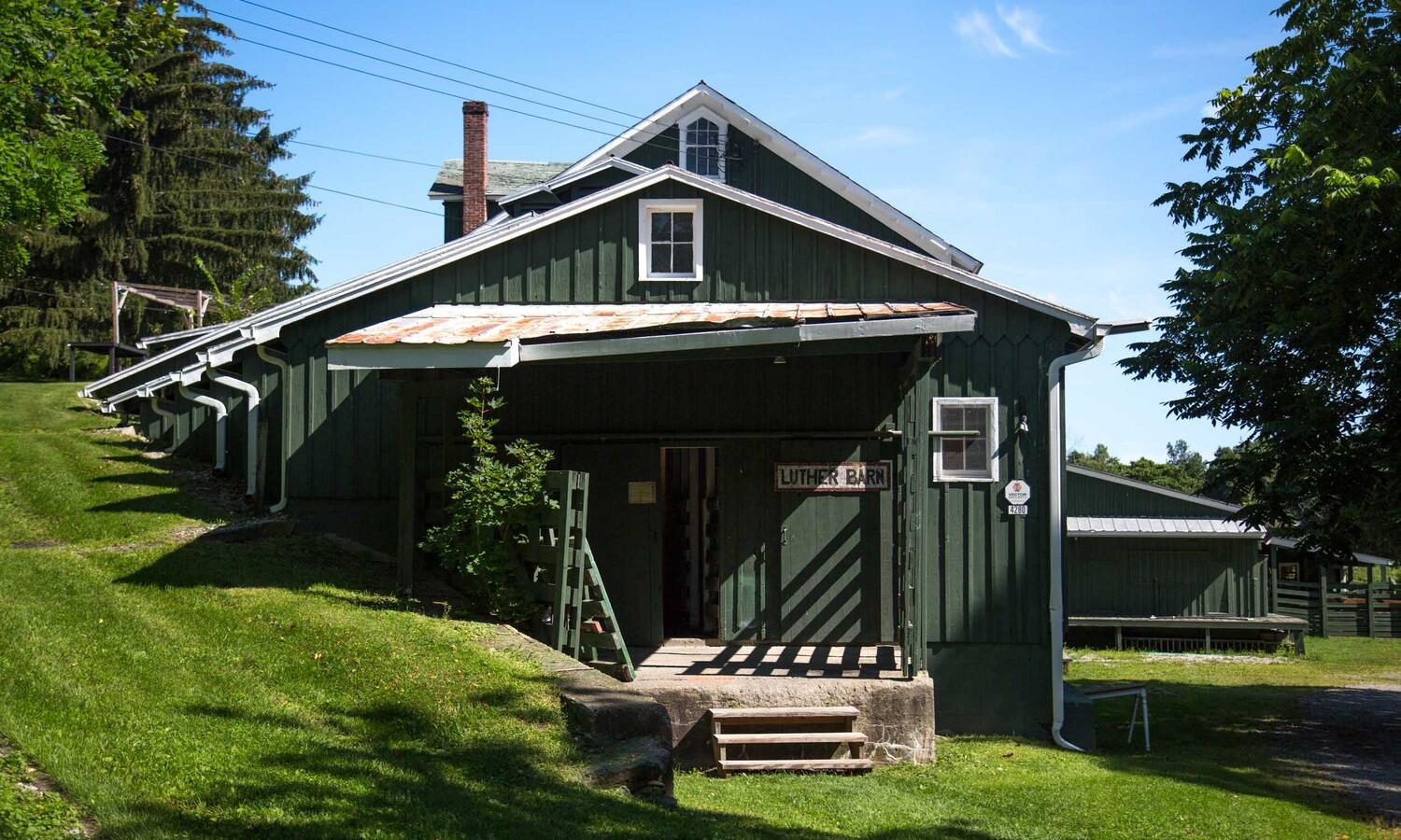 Luther Barn: former livestock barn, which houses our summer artist studios, seasonal Print shop, and Wood shop