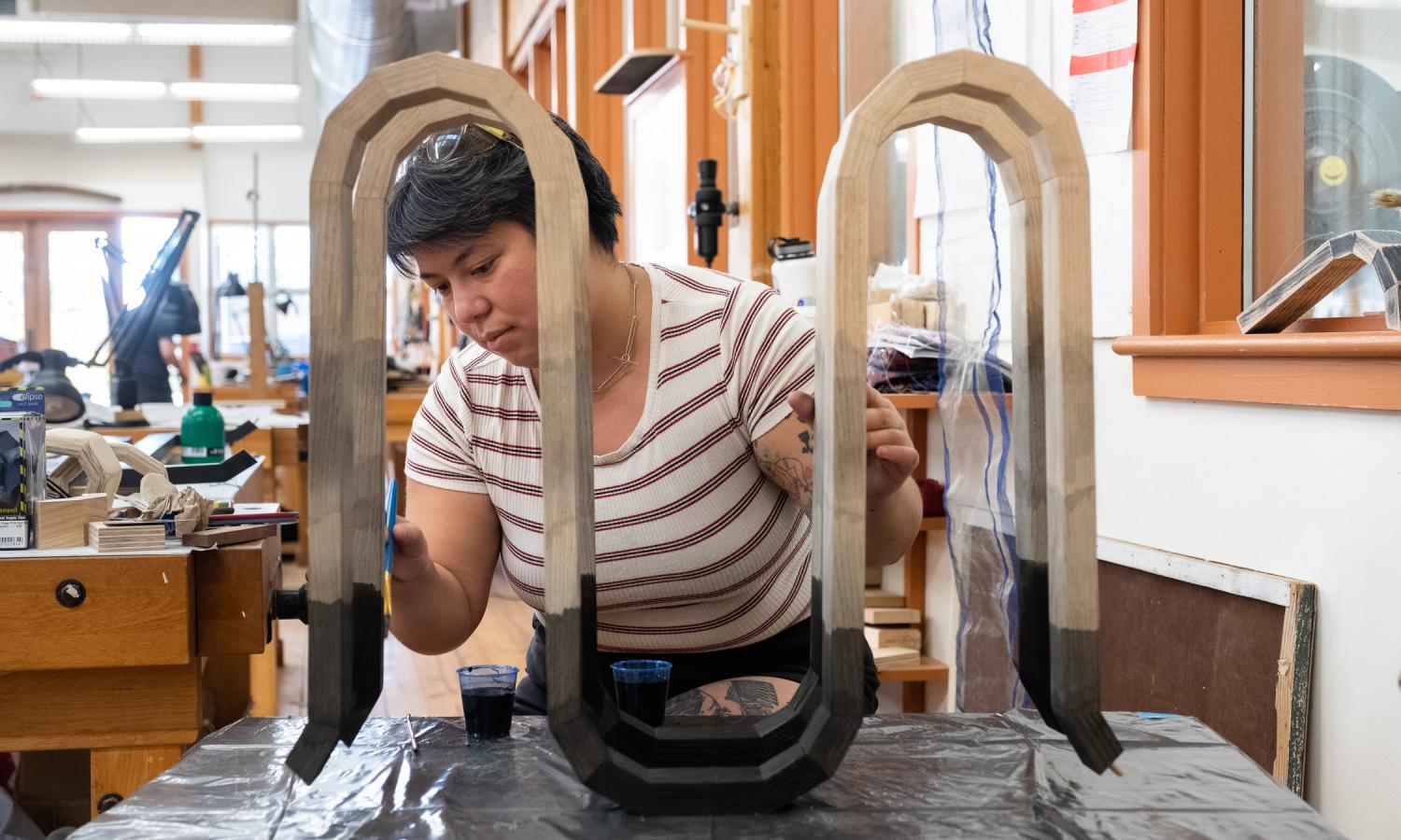 Core fellow Lars Shimabukuro working in the Penland wood studio