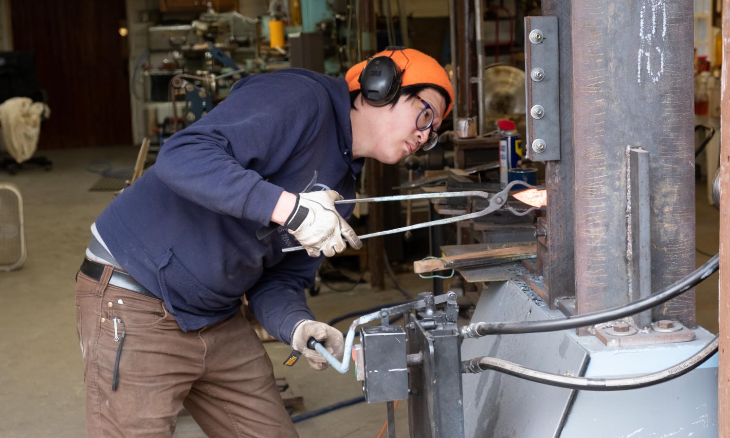 Resident artist Andrew Meers forms hot steel