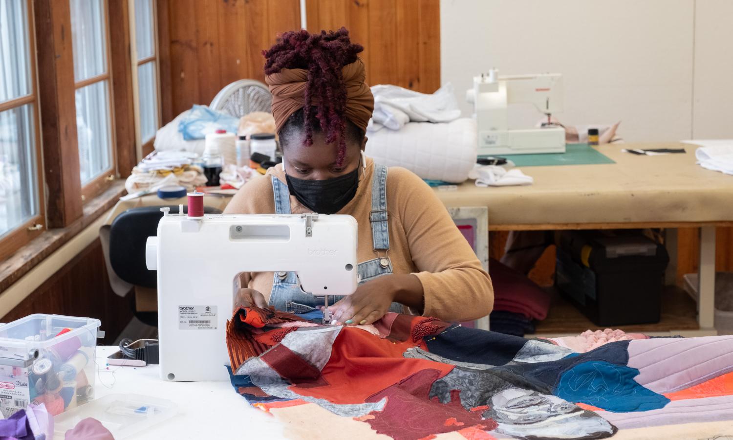 Winter resident Nastassja Swift piecing together a tapestry in the textiles studio
