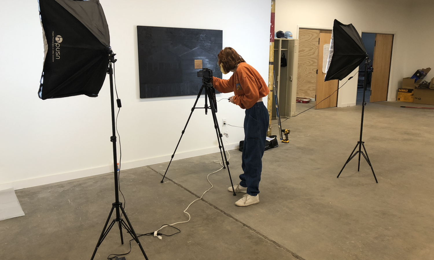 a resident photographing their work in the co-working space