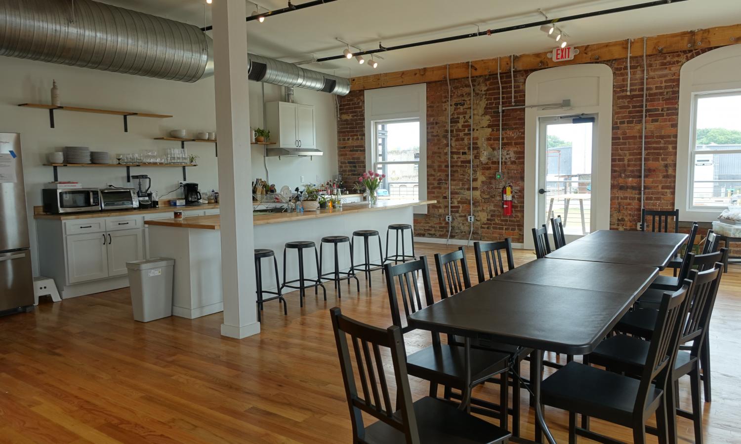 open floor plan kitchen with long table for group dinners