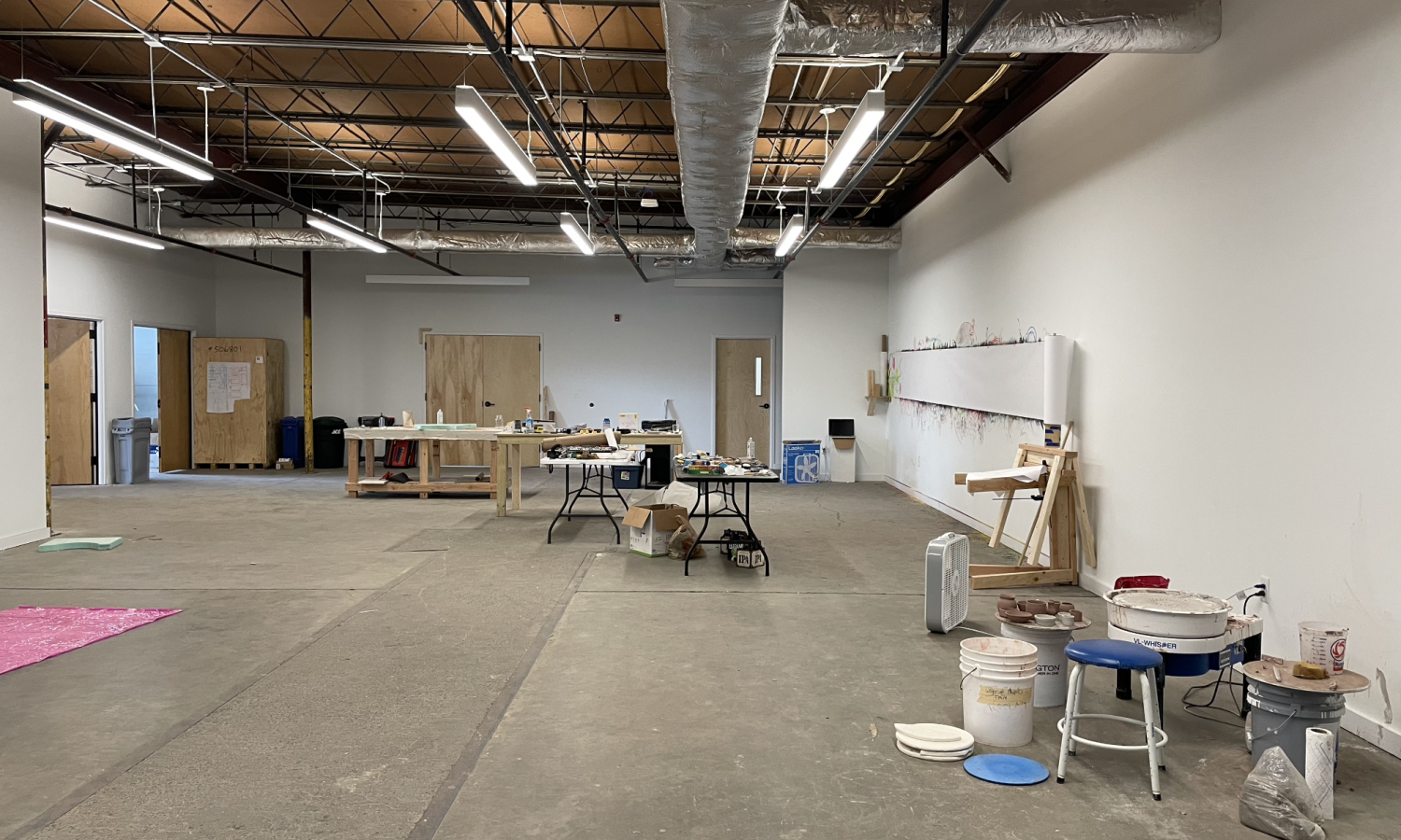 concrete floors and white walls in a raw co-working space