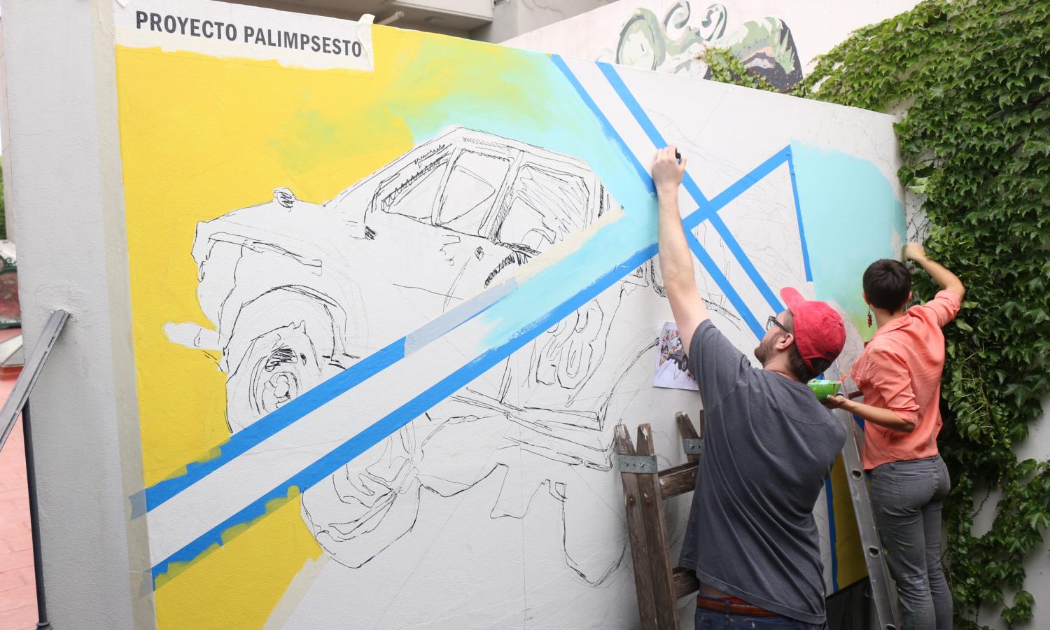 Artists working on their mural painting project