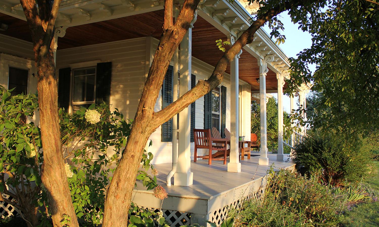 Close up of porch of house with chairs outside