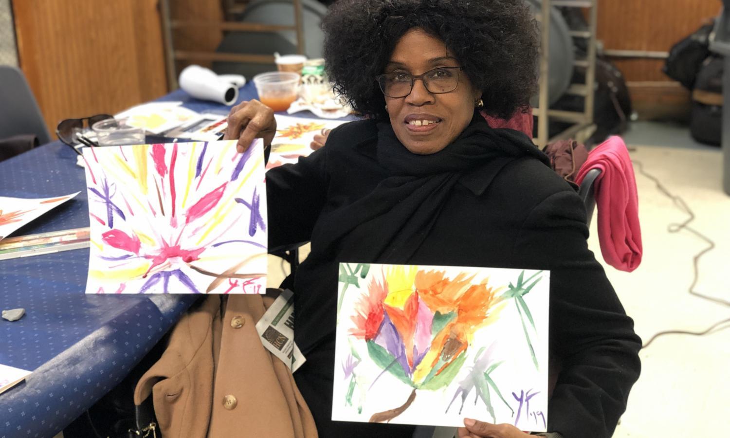 SU-CASA participant shows off her paintings