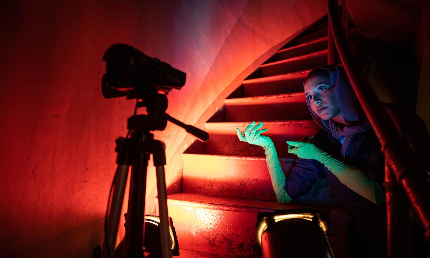 2022 Anderson Center Artist-in-Residence Azzah Sultan recording video in the staircase of the 100-foot water tower