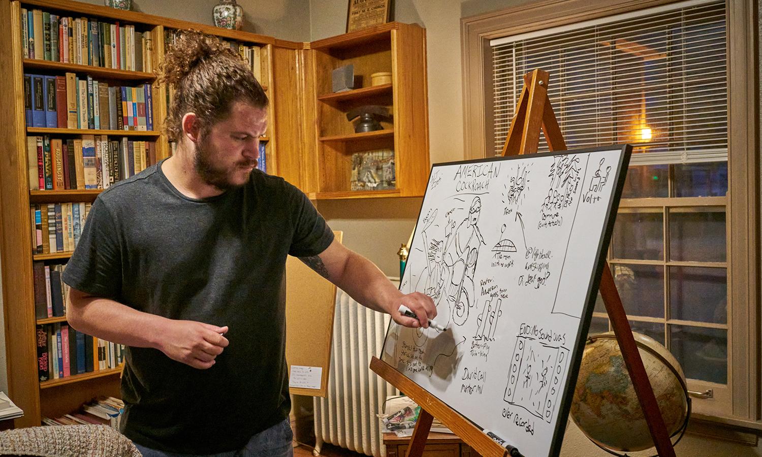June 2021 Anderson Center Artist-in-Residence Charlie Ainsworth in the main floor library