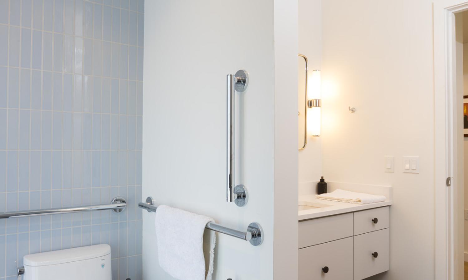 Shared ADA compliant full bathroom with shower only.