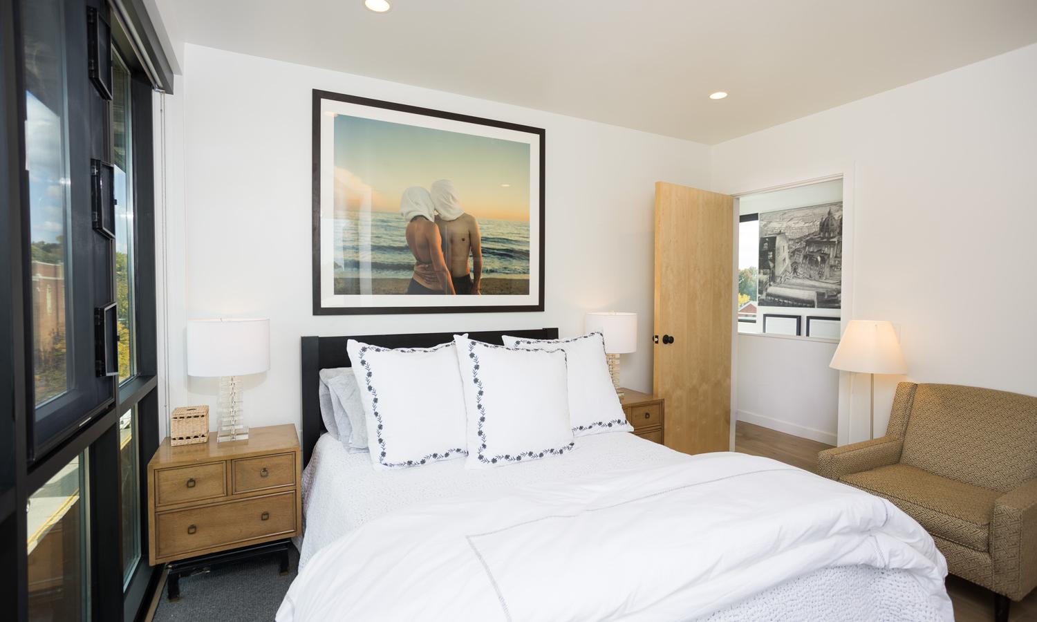 Bedroom Three with north and west facing windows. Located on the top apartment floor accessible by stairs only.