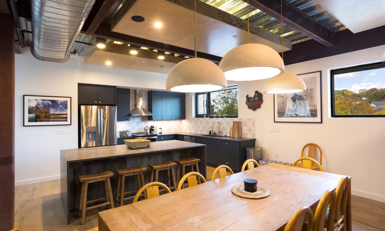 Open shared kitchen area. Located on the main apartment level accessible by stairs or elevator. Kitchen comes stocked with basic eating and cooking supplies and includes a dishwasher.