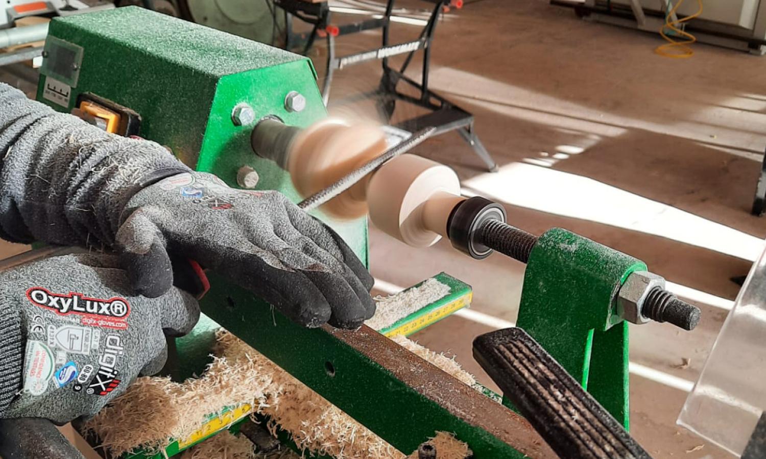 Object Room: artist operating a lathe