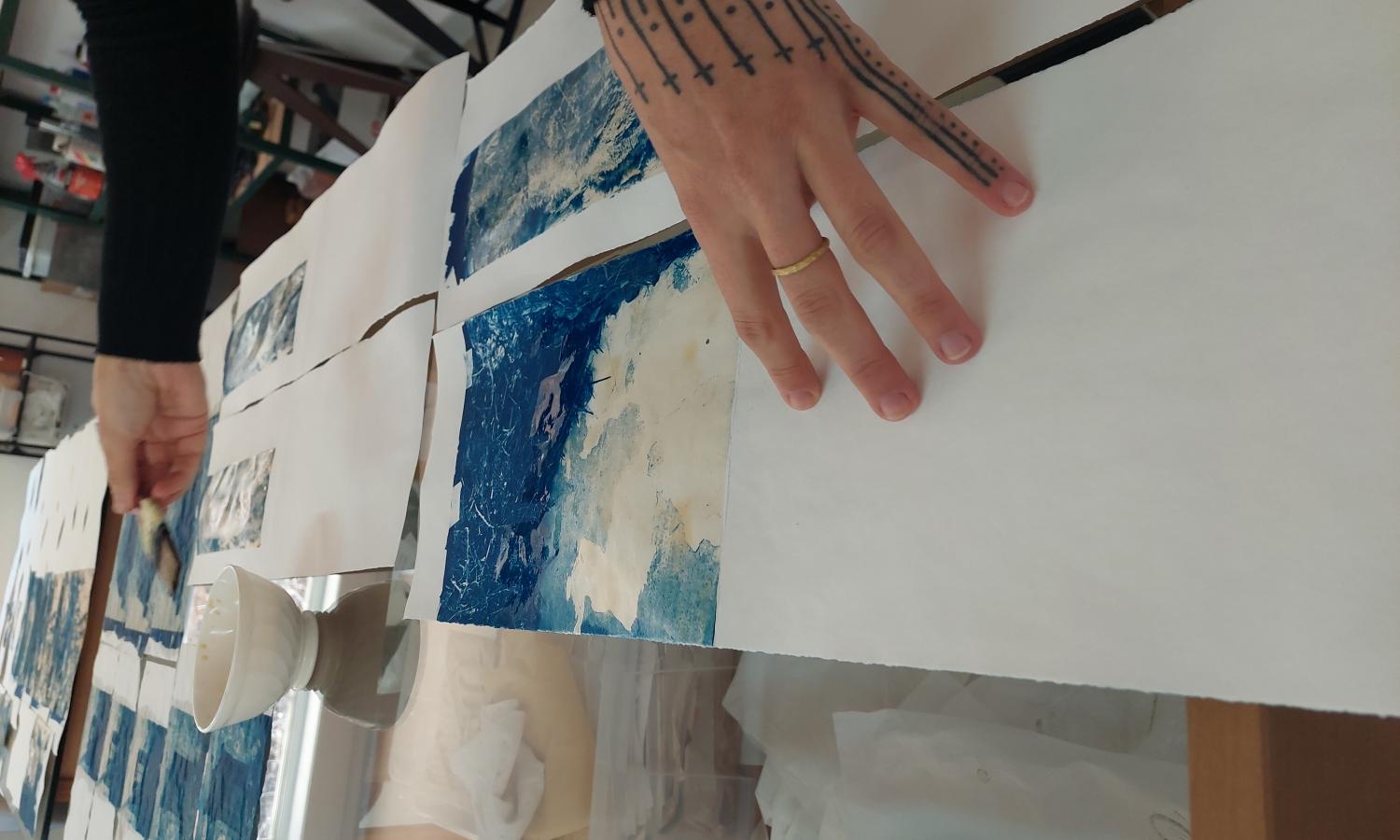 Hands toning cyanotypes - Elizabeth Robinson's work