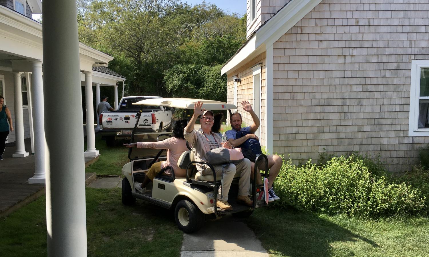 Artists driving golf carts