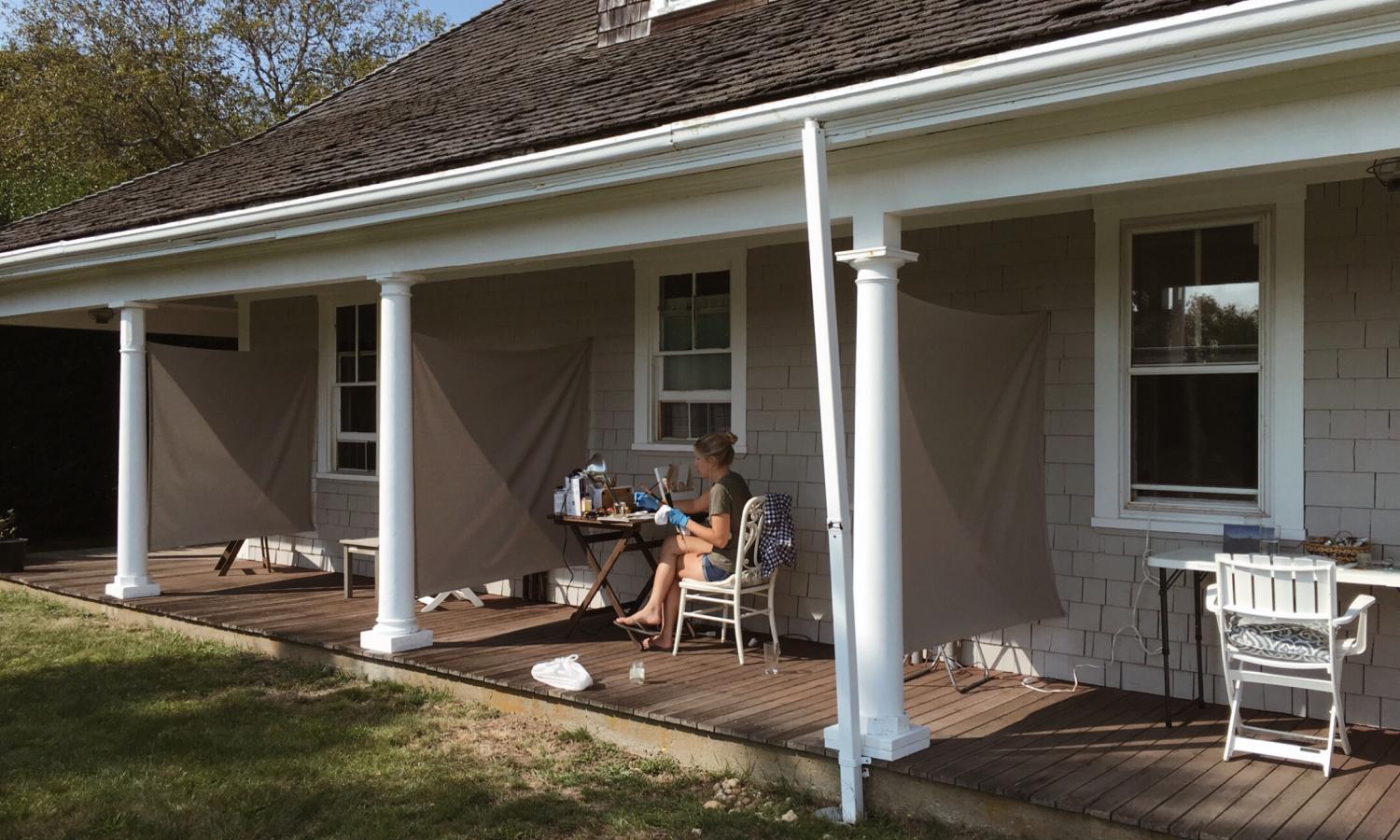 Artist working in an outdoor studio space