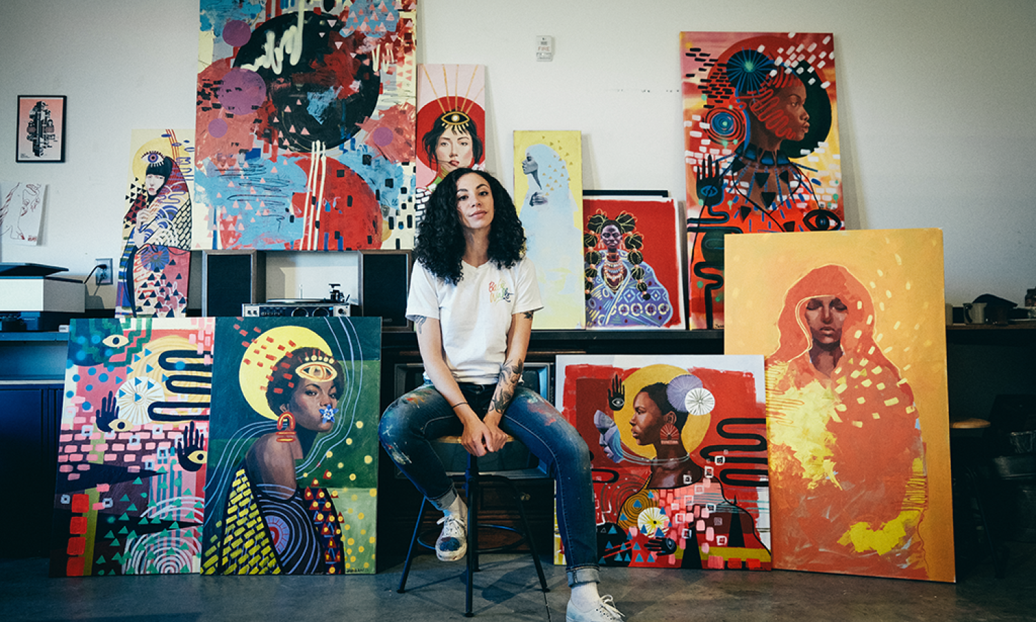 Jahna Rae in the studio with paintings