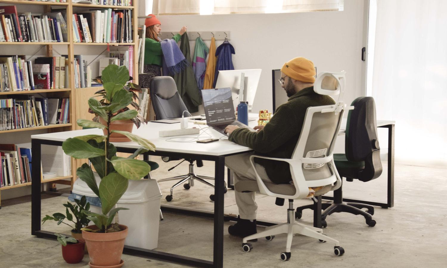 computer desk with library on the background