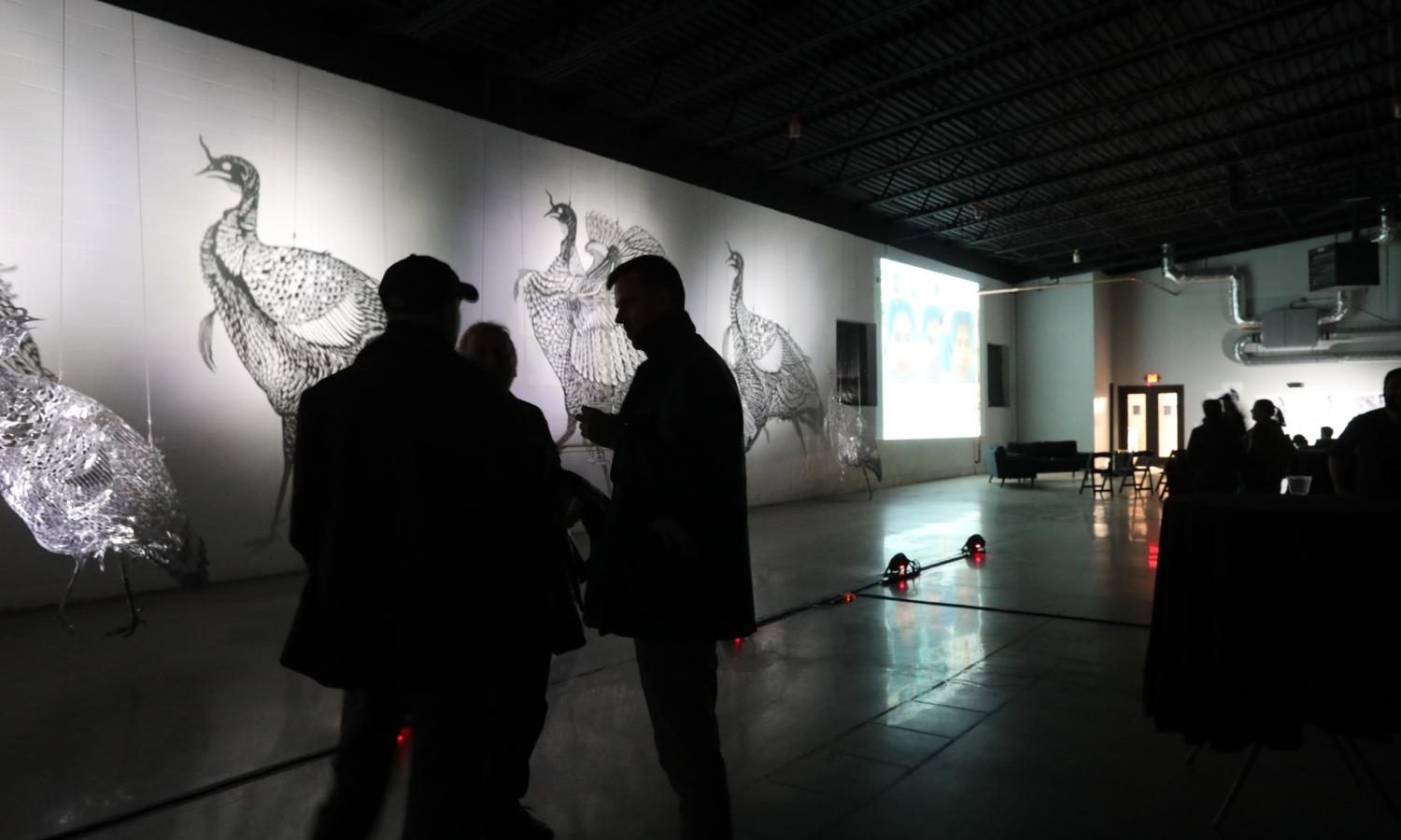 Alexander Augustus set the mood with these massive metal sculpture and playing with light.