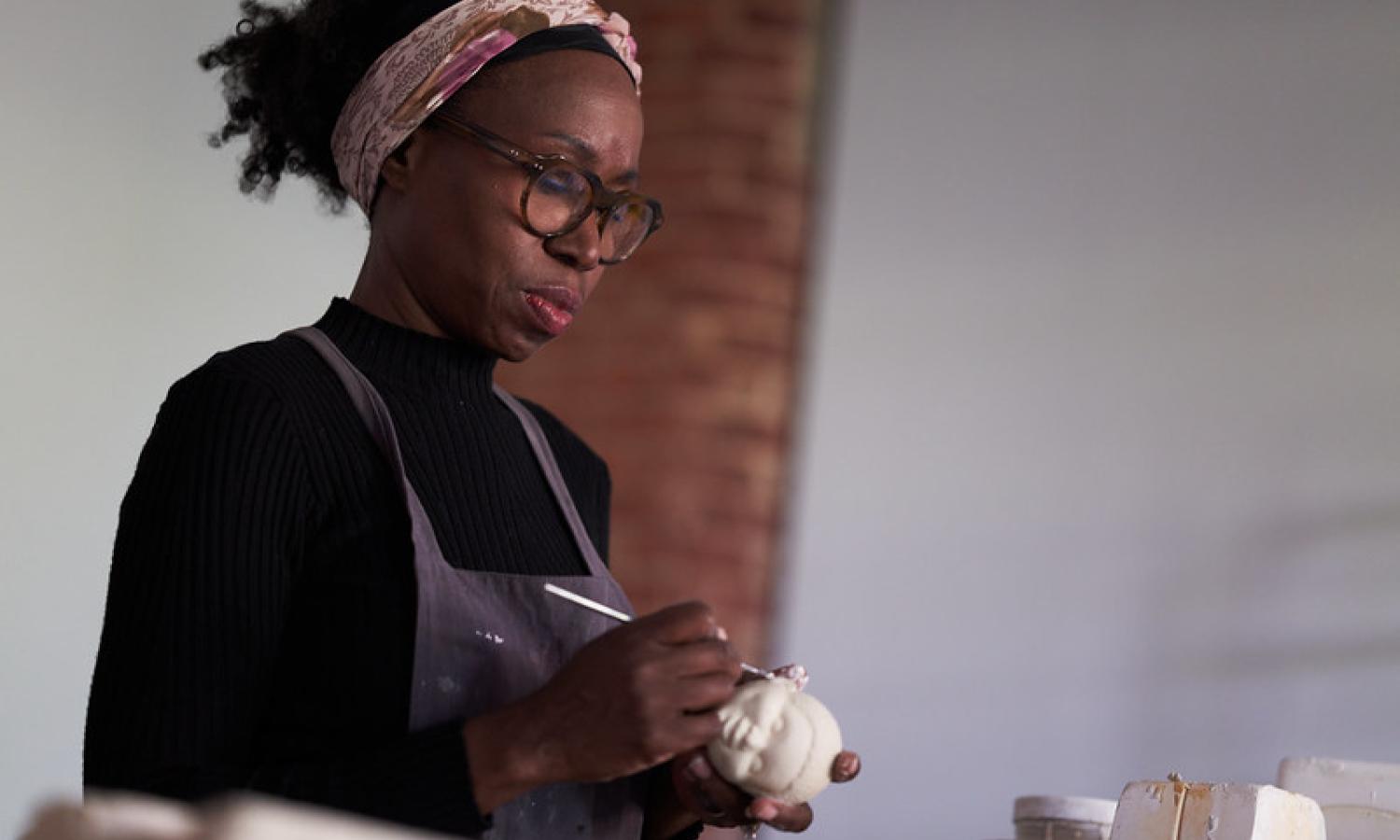 Sharon Norwood ceramic sculpting in her McColl Center Studio
