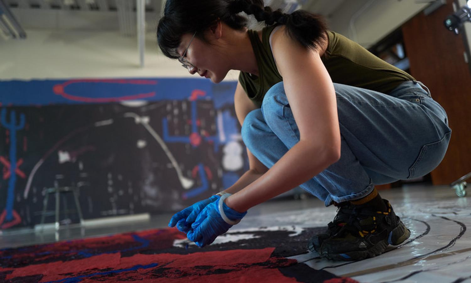 Artist Hong Hong working in McColl Center studio