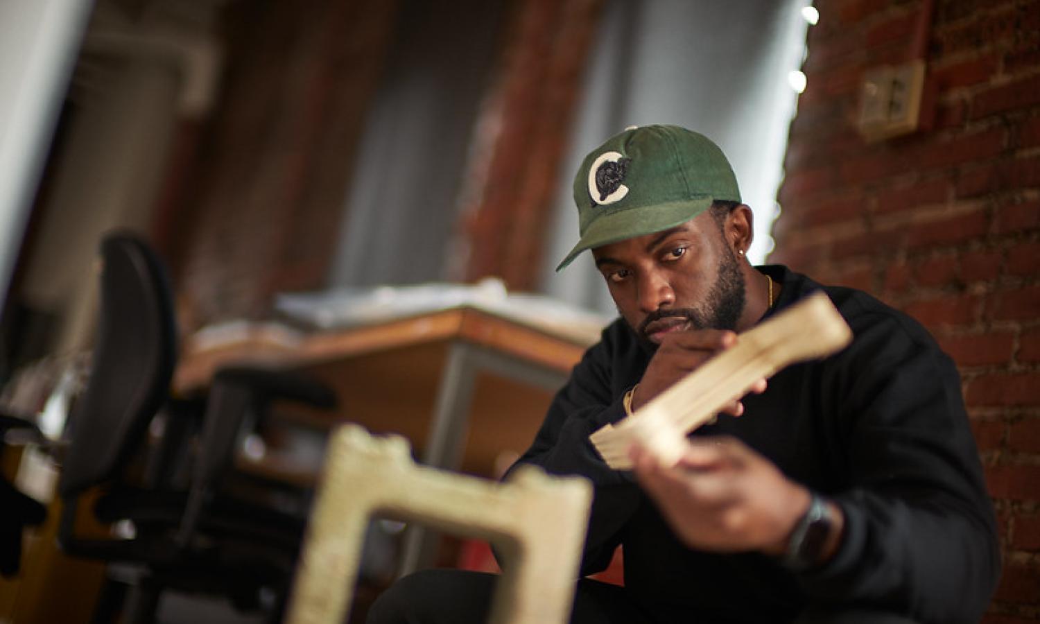 Artist Sherrill Rolan working in his McColl Center studio