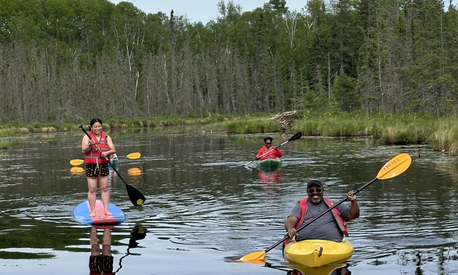 Artists kayaking on the lake