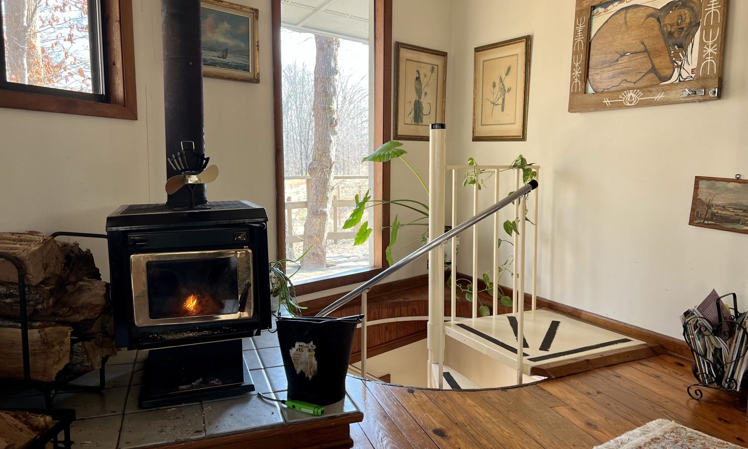 spiral staircase and wood burning fireplace