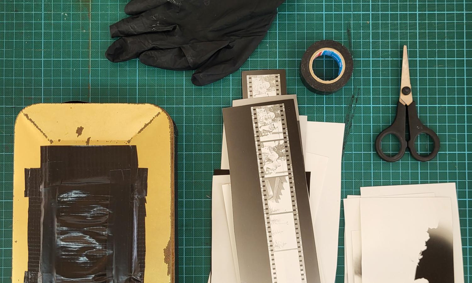 proof prints, pin hole, gloves and scissors