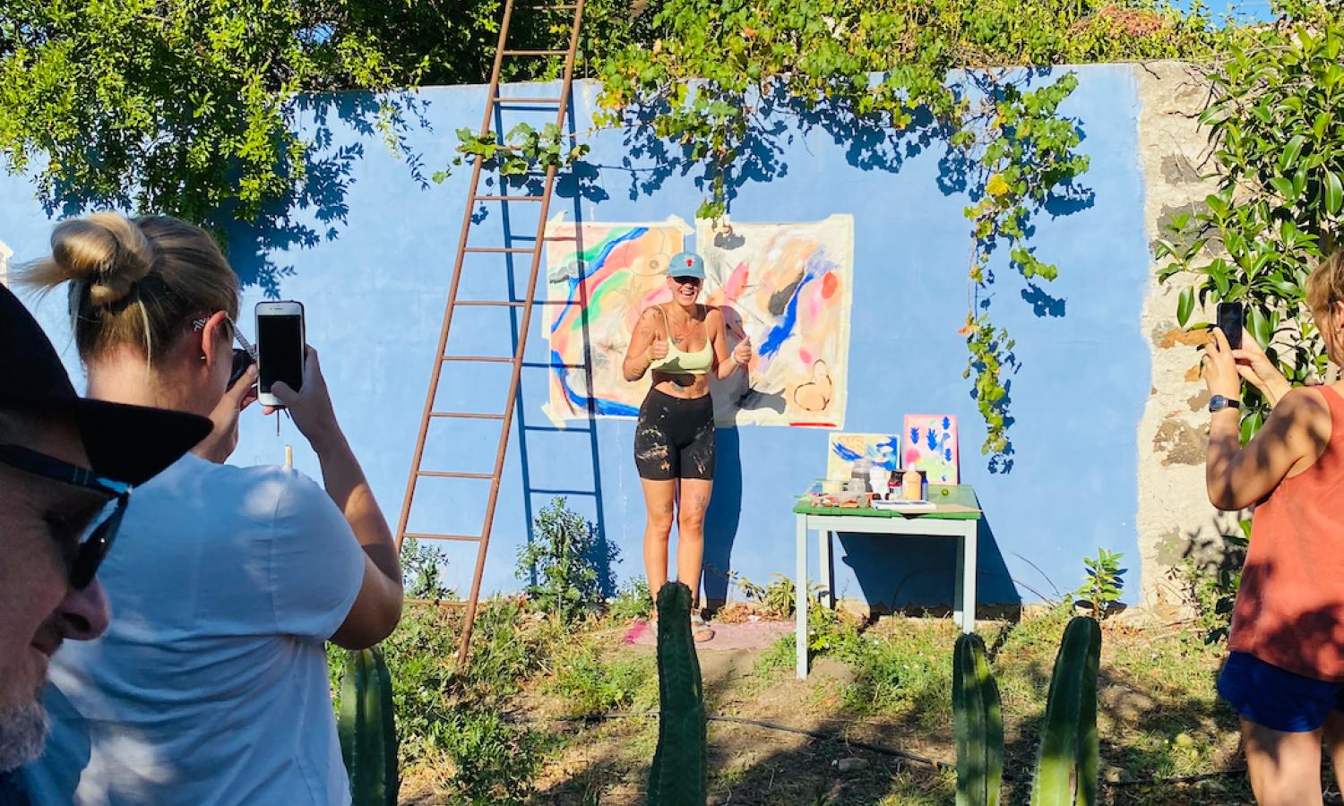 Artists sharing a moment in Casa Oaxaca's garden