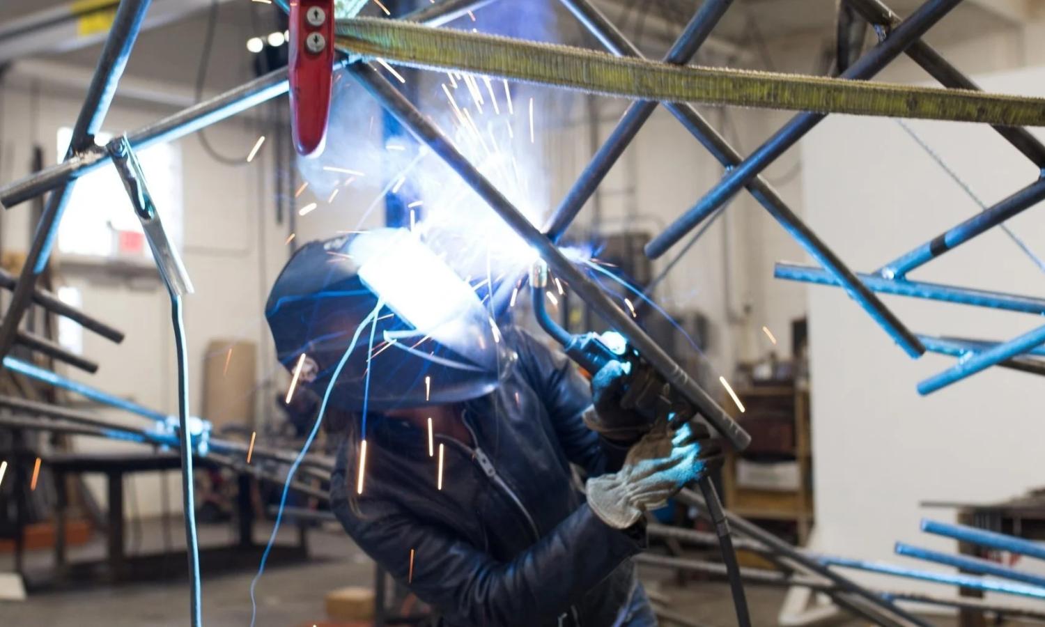 artists at work welding