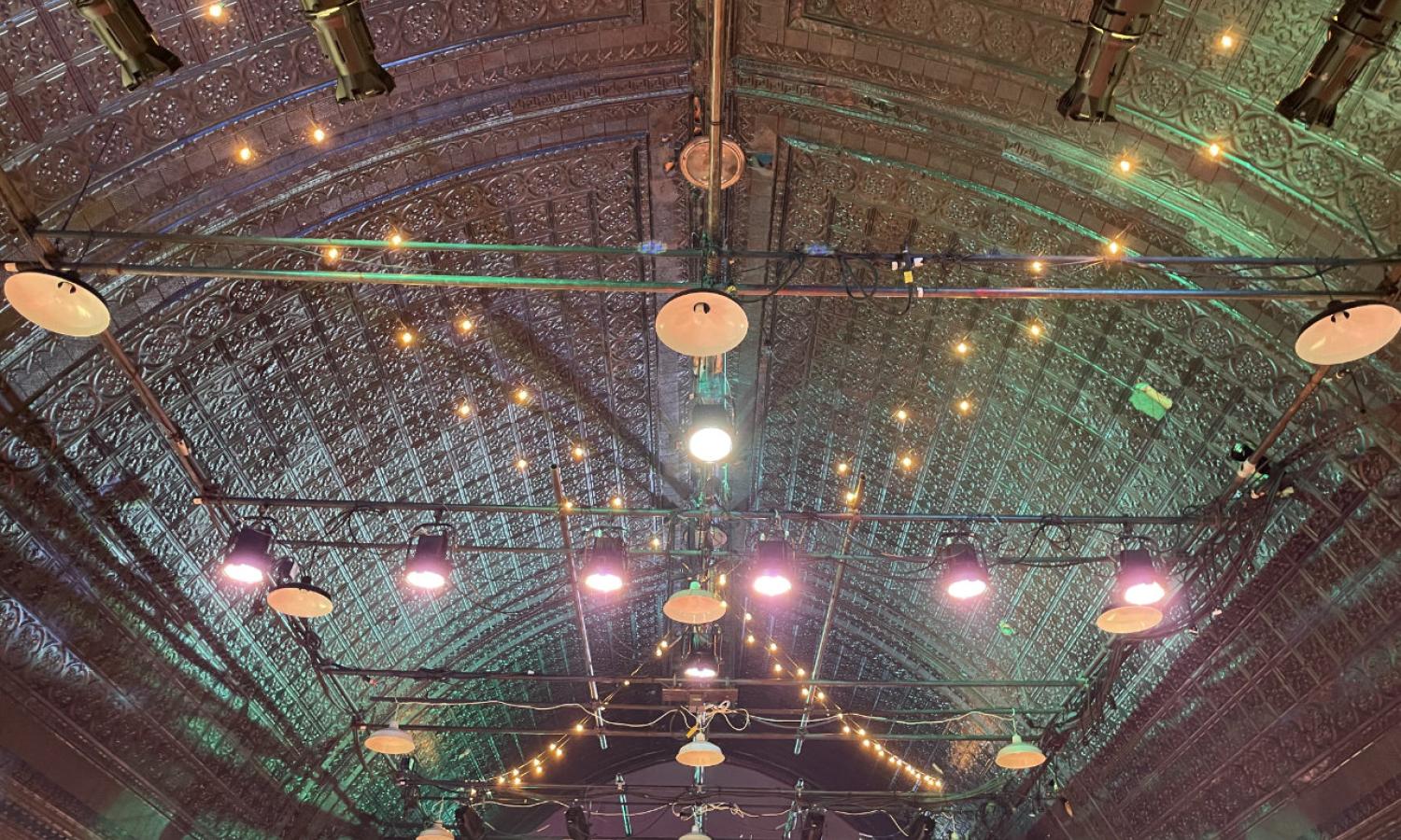 The NACL lighting grid and barrel-vaulted, pressed-tin ceiling
