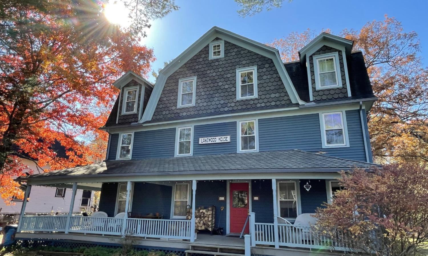 The NACL artist residence is a three-story gambrel-style former Catskills boarding house.