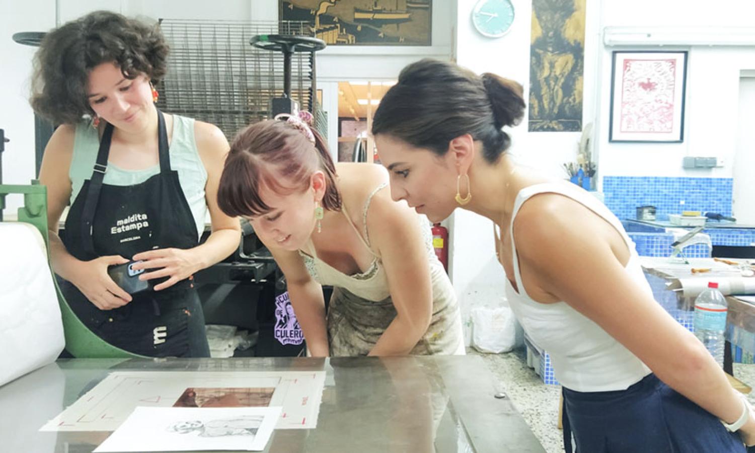 Artists printing during their residency