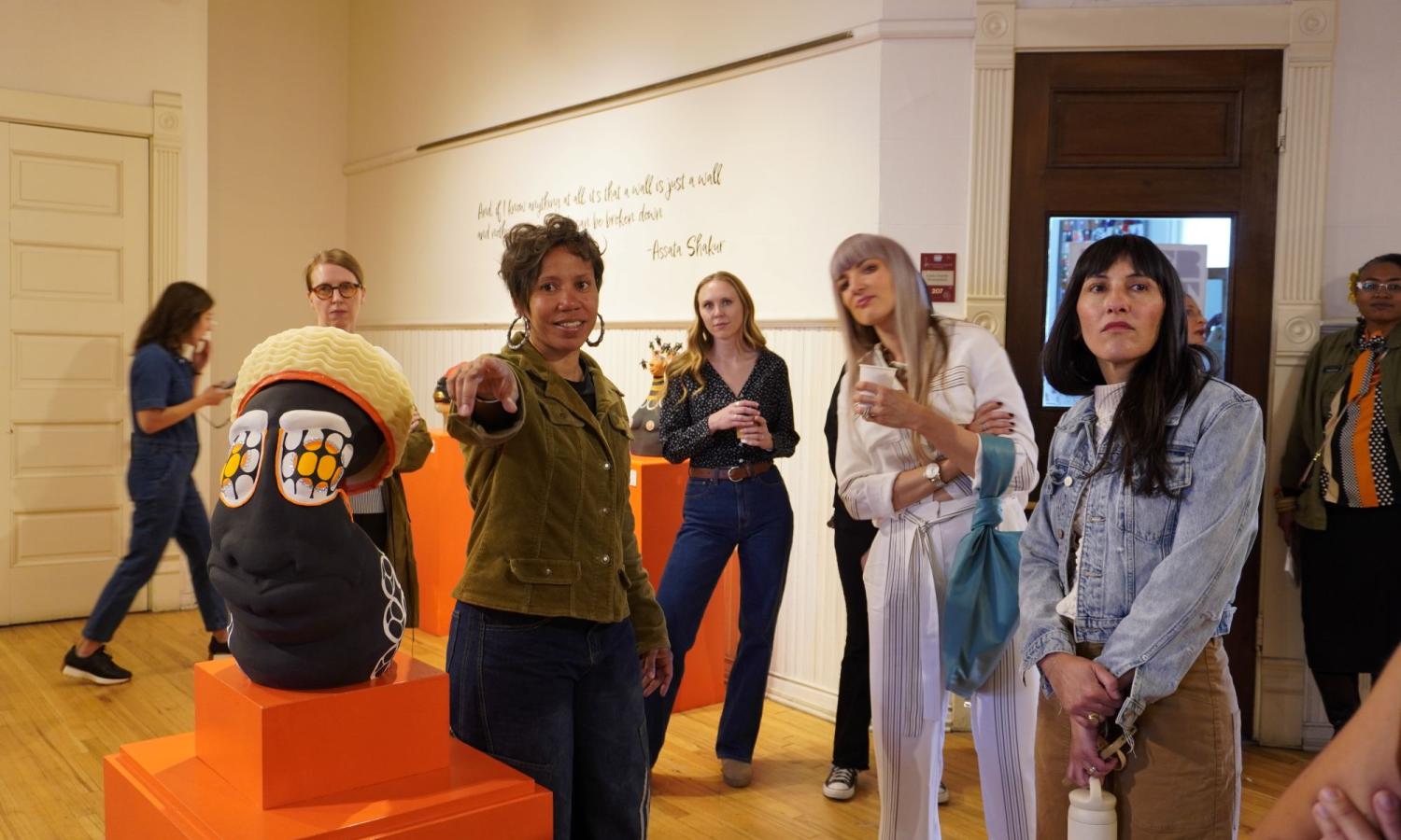 2025 resident Desirae Brown (pointing at sculpture) gives a tour of her solo exhibit at ASLD at the end of her residency.