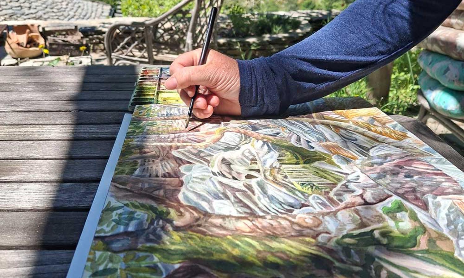 Landscape painter Sanneke Griepink painting from the Water and Roack art residency terrace in Thassos, Greece