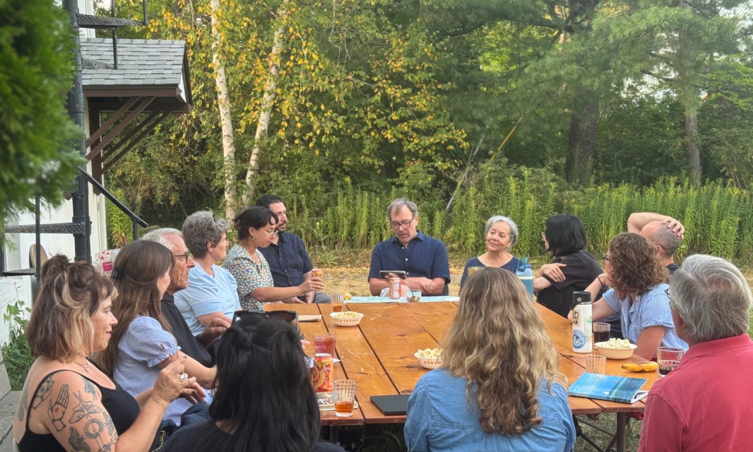 Artists gathered around a table