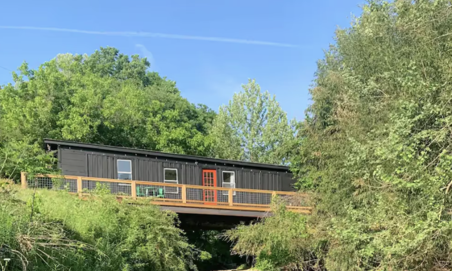Building surrounded by water and trees