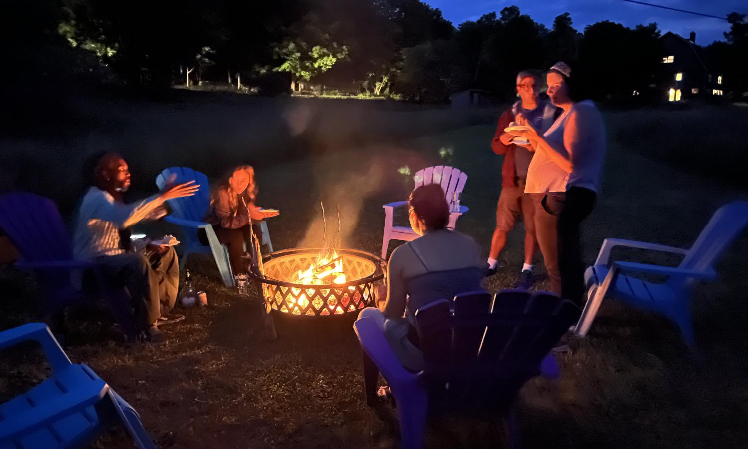 Photo of participants around campfire