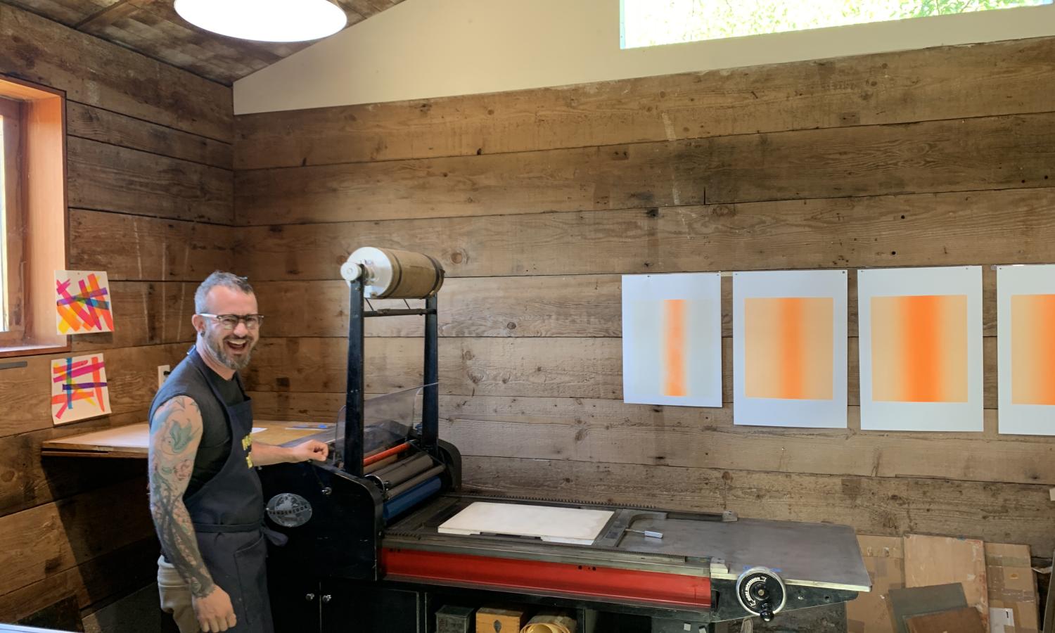 Artist working on Vandercook letterpress